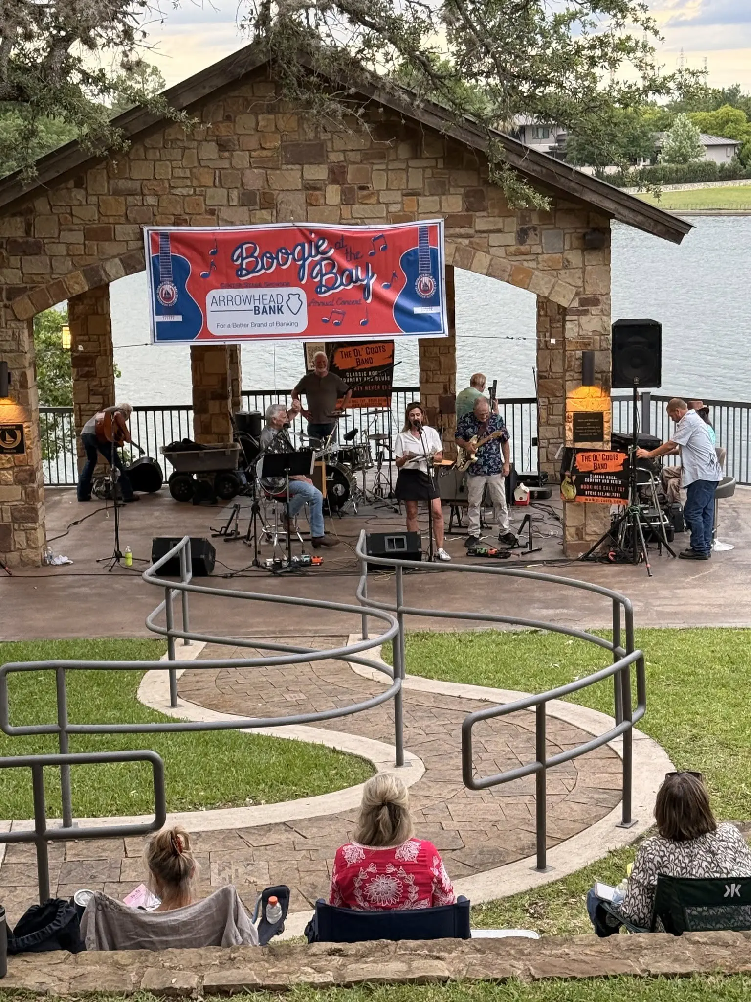 Live band playing at lakeside stone pavilion
